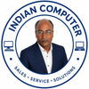 A circular logo featuring a portrait of a man in a navy blazer and white shirt, with the text 'INDIAN COMPUTER' around the top half and 'SALES • SERVICE • SOLUTIONS' around the bottom half. Computer icons appear on both sides.